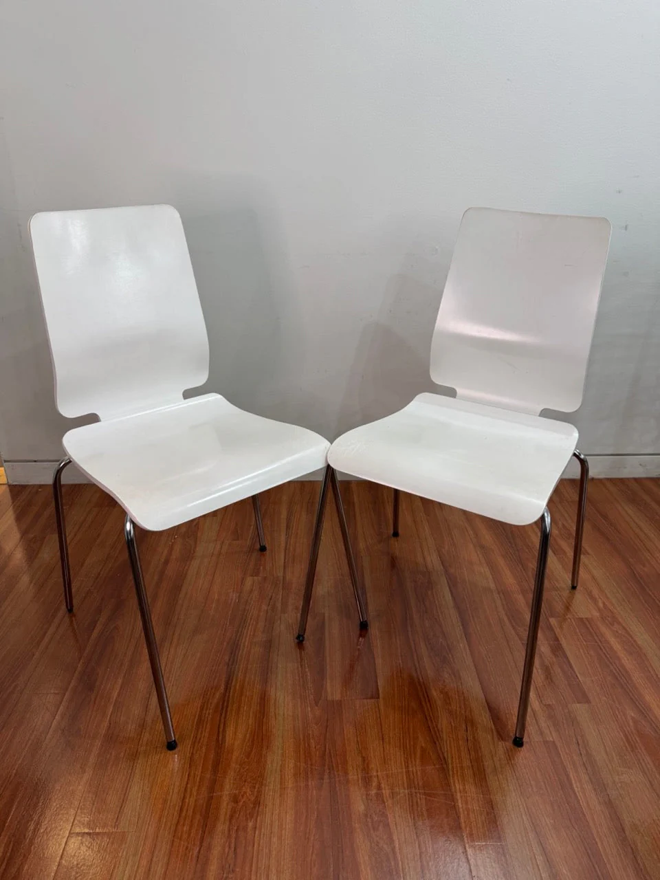 Pair of white IKEA chairs.